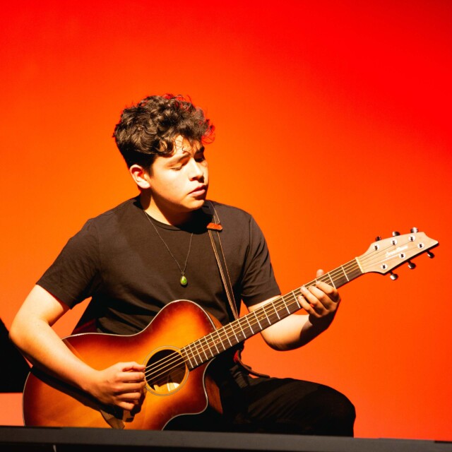 A guitarist performing.