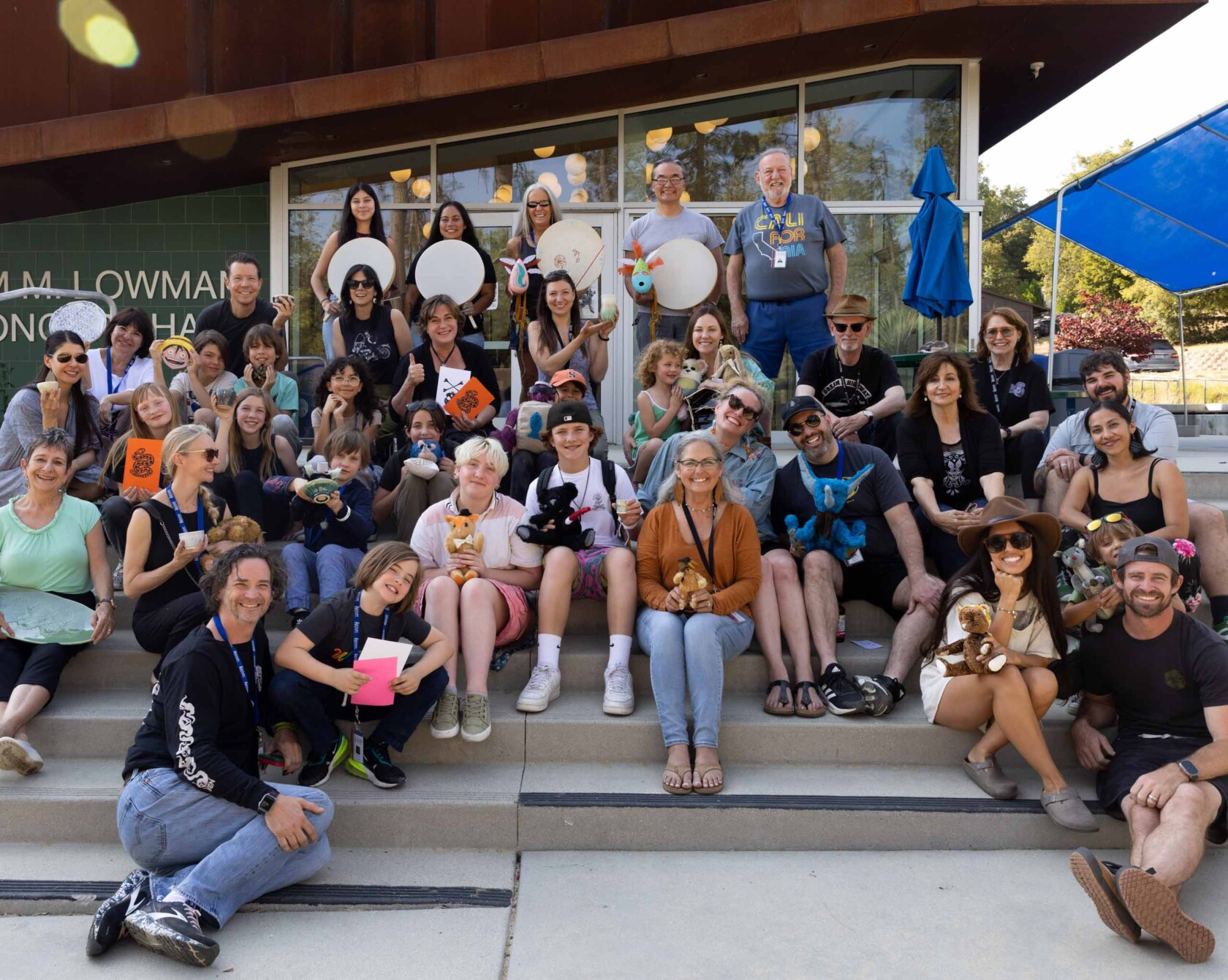 A group of people on the steps of the William M. Lowman concert hall.