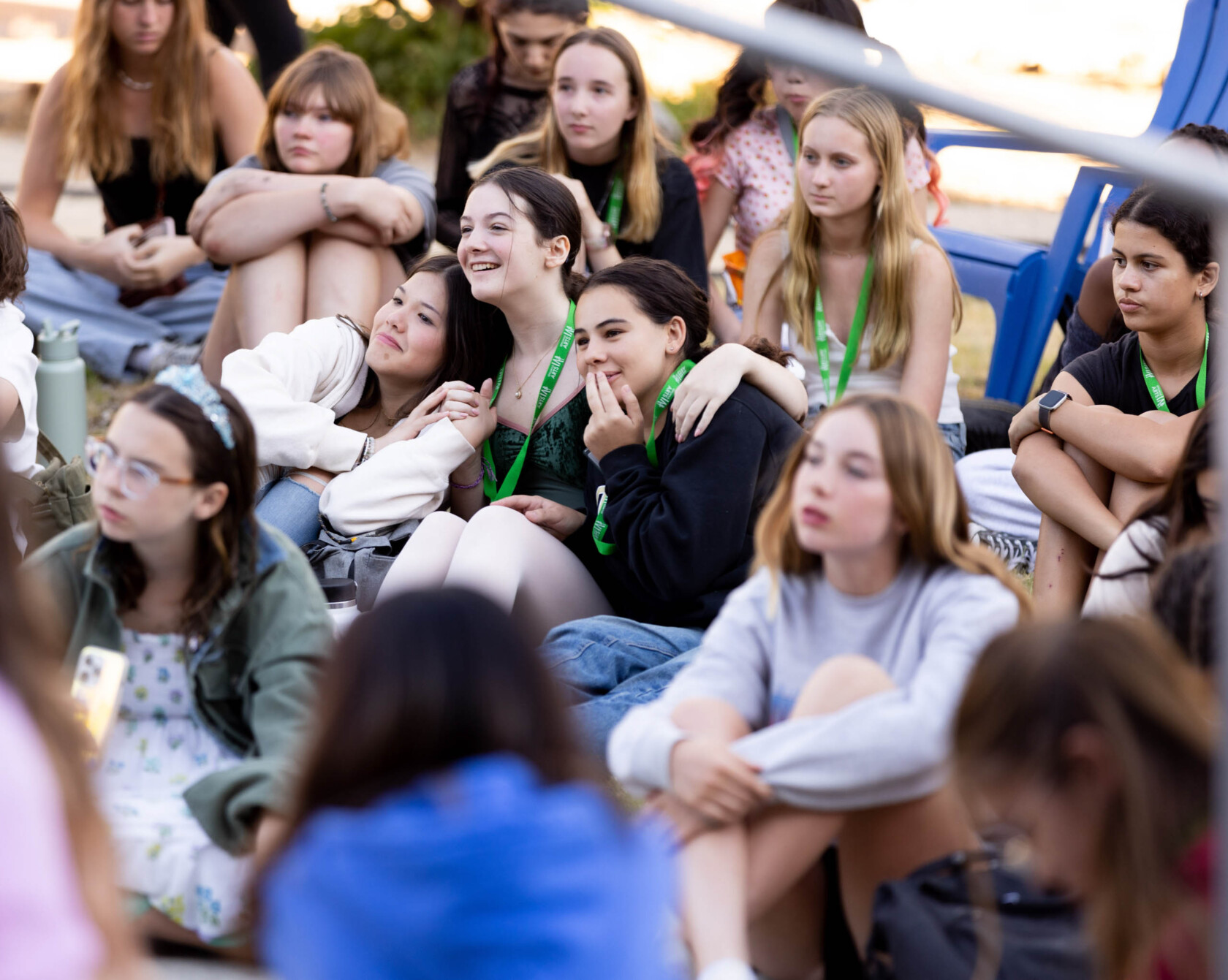 A group of teenagers sitting together.